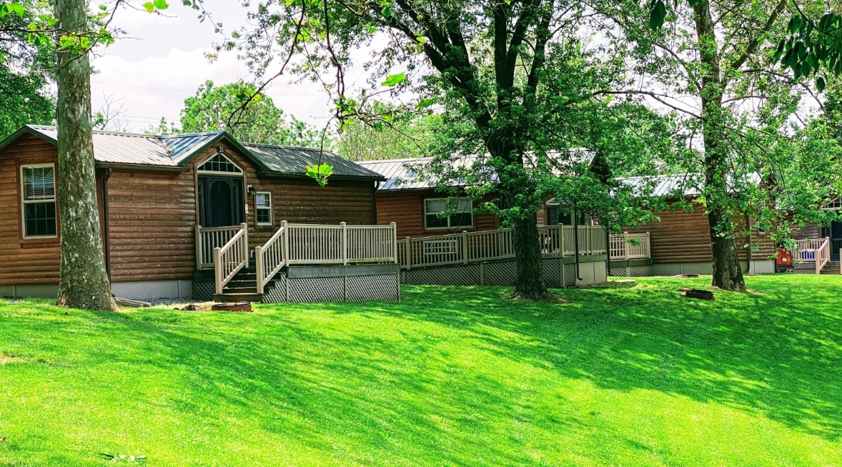 grassy area in front of cabins