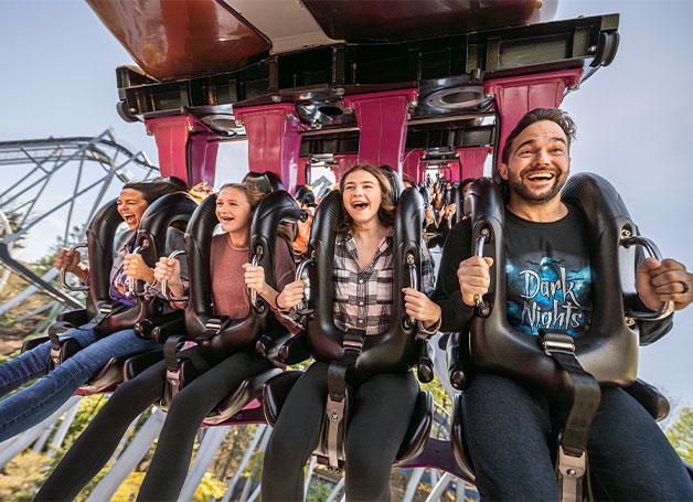 Family riding coaster at Hersheypark Dark Nights