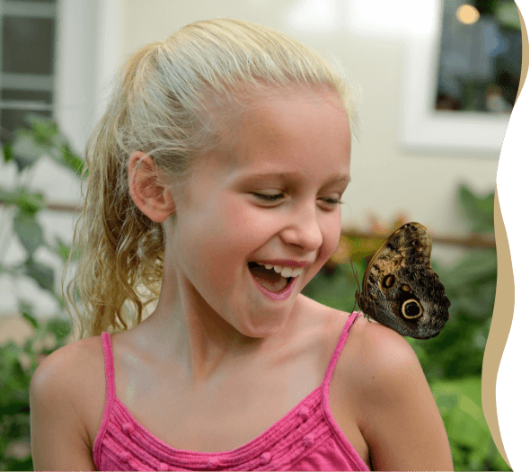 Girl with butterfly at Hershey Gardens